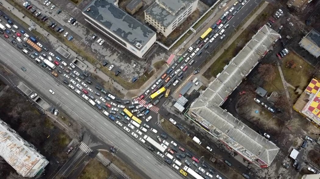 Drone image of heavy traffic on a road heading out of the Ukrainian capital Kyiv as people flee the capital city in anticipation of Russian military operations.