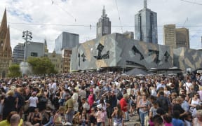People pay their respects to the Bourke Street victims at Federation Square in Melbourne last Monday.