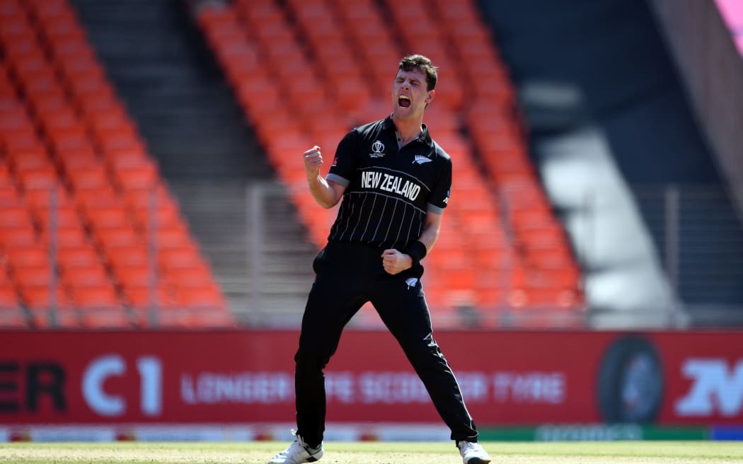 New Zealand's Matt Henry celebrates the wicket of England's Dawid Malan.