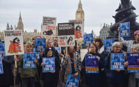 Demonstrators call for the release of the penguins at a protest on 19 October.