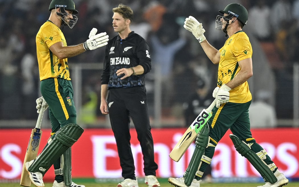 South Africa's captain Aiden Markram (L) and David Miller (R) celebrate their win over New Zealand at the T20 World Cup.