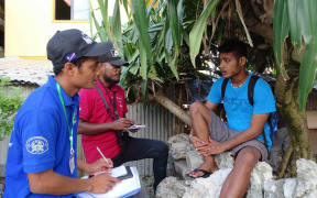 Marshall Islands census takers Barney Takrkij and Childson Henson interview Majuro resident Jeban Henson in this August 29, 2021