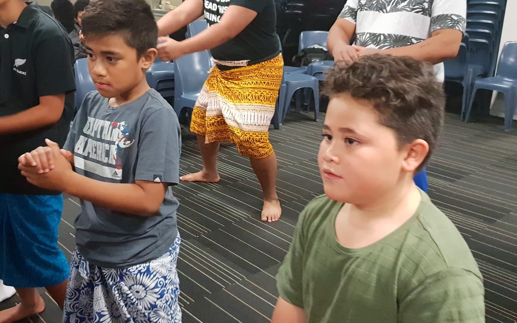 Gedalya Parker, 8, in grey shirt practises the Rotuman tautoga.