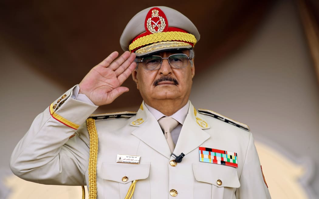 Khalifa Haftar salutes during a military parade in the eastern city of Benghazi.