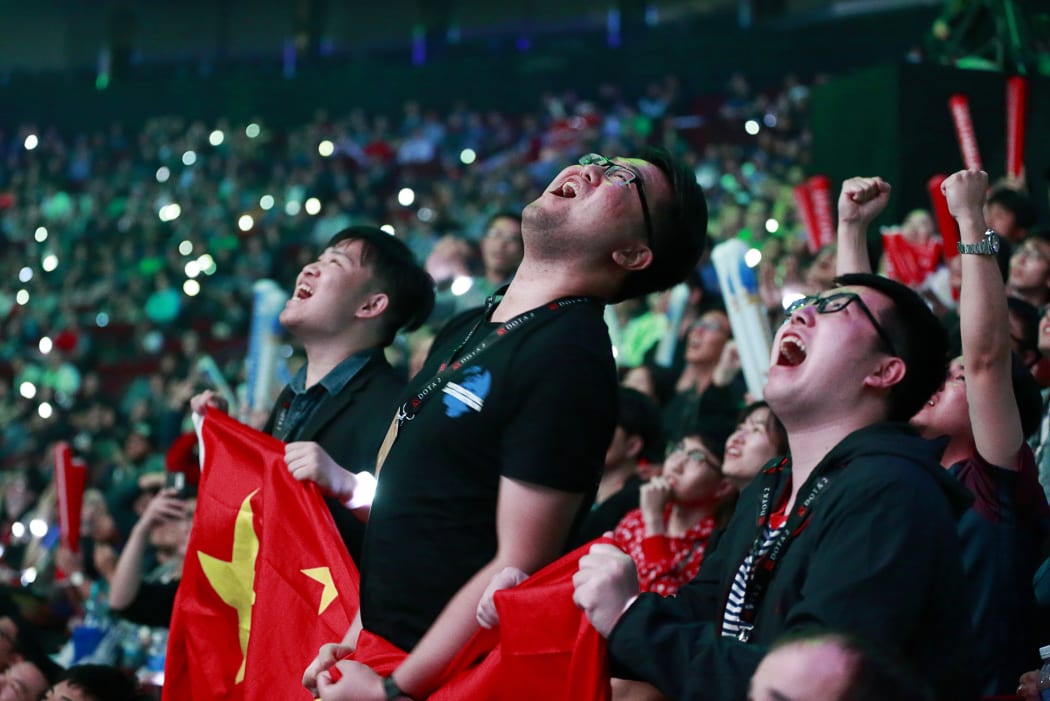 LGD fans react during the Dota 2 grand final match between PSG.LGD and OG on Day 6 of The International 2018 at Rogers Arena on August 25, 2018 in Vancouver, Canada.