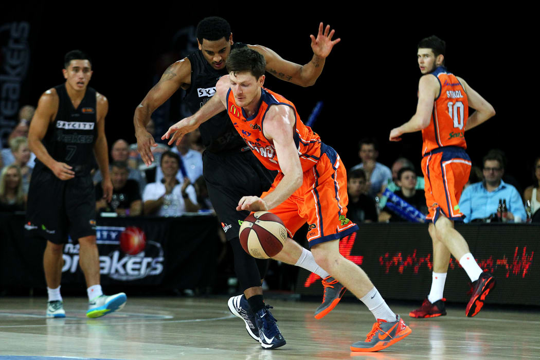 Corey Webster of the Breakers bodies up on Cameron Gliddon of the Taipans.