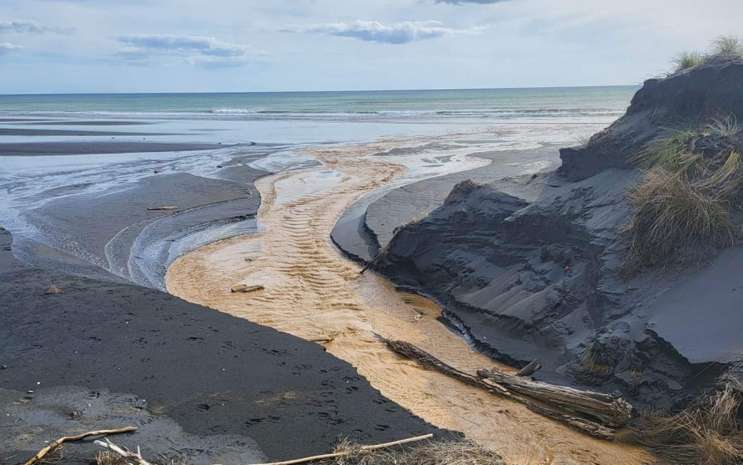 The discharge channel to the beach Taharoa Ironsands.