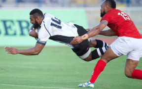 Fiji's Waisea Nayacalevu scores against Tonga in the Pacific Nations Cup 2015.