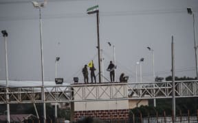 YPG fighters hold their movement's flag.