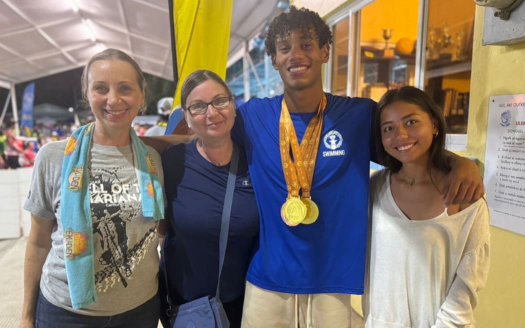 Northern Mariana Islands swimmer Isaiah Aleksenko with his supporters at the 2025 Pacific Mini Games in Koror. 1 July 2025