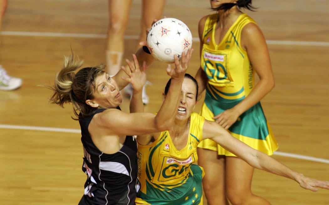Silver Ferns' Irene van Dyk is hit by the defence of Australia captain Liz Ellis during the Final of the Netball World Championships between New Zealand & Australia, Auckland, New Zealand, Friday, Nov. 16 2007. Photo: Hagen Hopkins/PHOTOSPORT