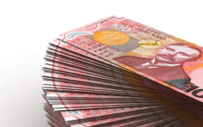 A stack of NZ $100 bills.
