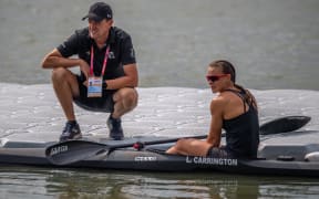 Coach Gordon Walker and Dame Lisa Carrington.