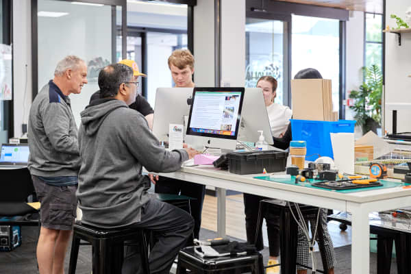 Library users at Hamilton Central Library and Makerspace where the public can access a range of electronic and robotic equipment.