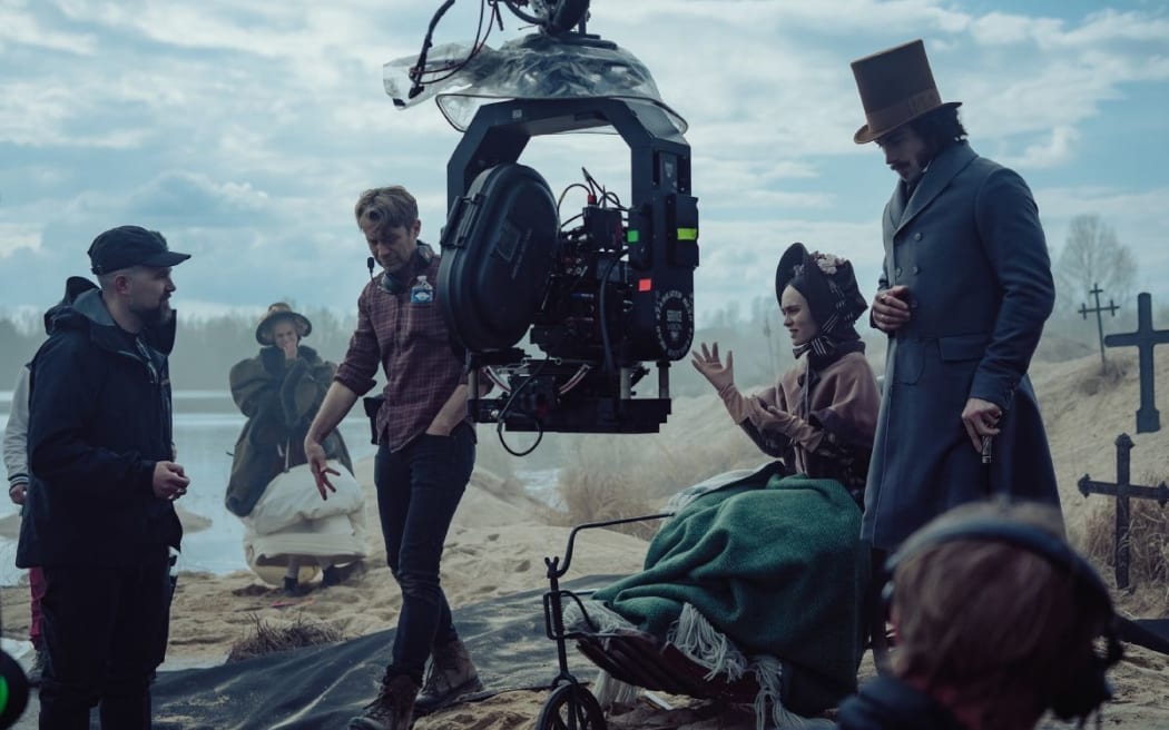 Robert Eggers, DP Jarin Blaschke, Lily-Rose Depp, and Aaron Taylor-Johnson on the set of Nosferatu.