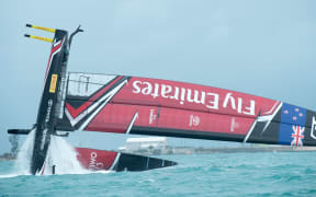 Team New Zealand capsized just moments after crossing the start line.
