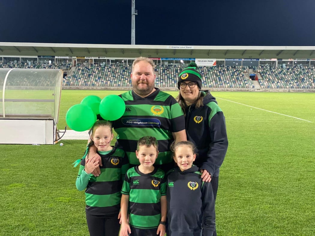 Bayden + Shaye Anderson and their three children at the Porangahau rugby final at McLean Park in Napier