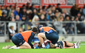 Connor Vest is treated after being injured in the Highlanders v Reds Super Rugby Pacific match at Forsyth Barr Stadium, Dunedin.