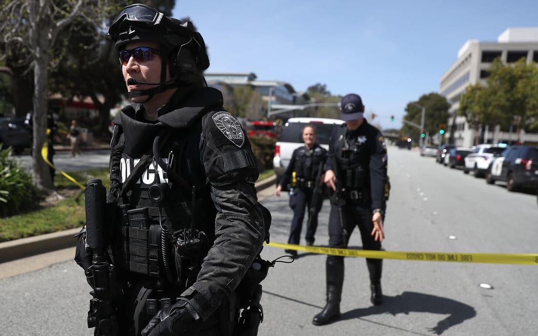 Law enforcement stands watch outside of the YouTube headquarters during the active shooting alert.