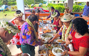 RAROTONGA -  DEC 28 2017: Cook Islanders people eat traditional food.Group of south Pacific islands are banning foreign junk food imports in favour of an all-local organic diet as a way to combat future health problems