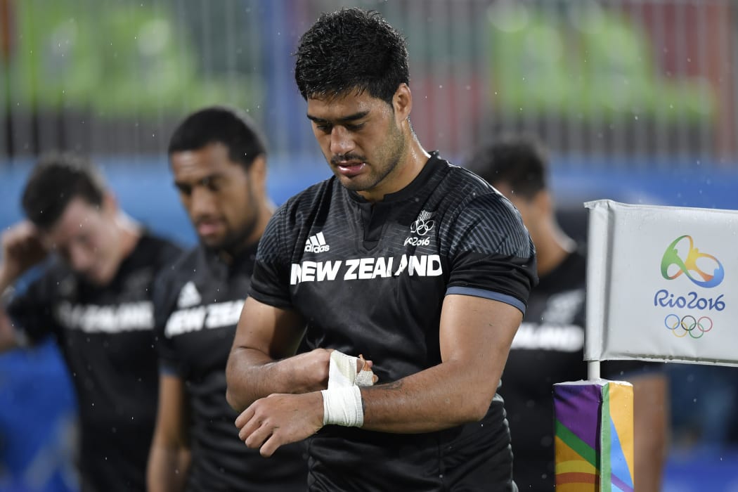 Akira Ioane reacts after defeat in the men’s sevens quarter-final match between Fiji and New Zealand during the Olympic Games.