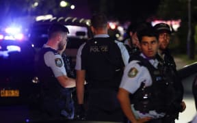 New South Wales police gather outside the Christ the Good Shepherd Church in Sydney's western suburb of Wakeley on April 15, 2024, after several people were stabbed in the church premises. Australian police arrested a man after several people were stabbed at a church in Sydney on April 15 and emergency services said four people were being treated for non-life threatening injuries. (Photo by David GRAY / AFP)