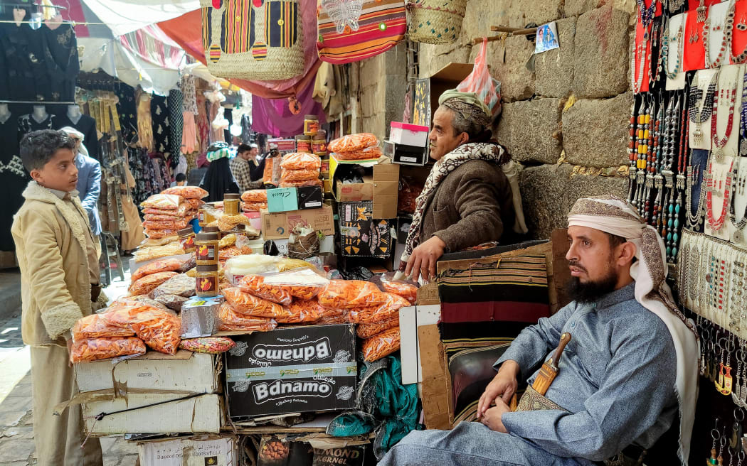 Merchants wait for customers at the old market in Sanaa, Yemen, on 4 February 4, 2024. The United States and Britain struck dozens of targets in Yemen late on February 3, their third joint operation in response to repeated attacks on Red Sea shipping by the Iran-backed Houthis that have disrupted global trade. (Photo by Mohammed HUWAIS / AFP)
