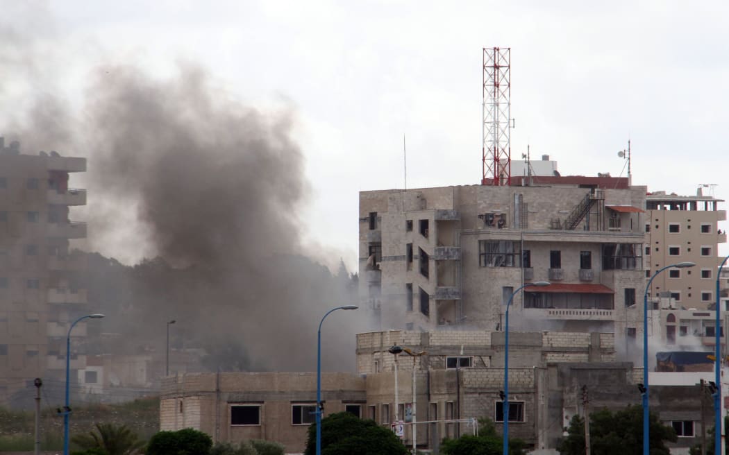 Smoke can be seen from one of three bombs in Tartous on the coast of Syria. Four locations in the city of Jableh, further north, were also bombed.