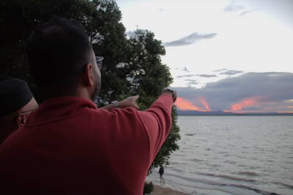 Muslims point to the direction where they're hoping to spot the hilal, or crescent moon, at Point Chevalier's Coyle Park on 18 February, 2026.