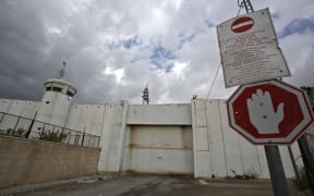 The crossing gate between the Israeli occupied West Bank city of Bethlehem and Jerusalem remains closed on March 6, 2020, following a lockdown on the biblical city, after the first Palestinian cases of the deadly coronavirus were discovered there.