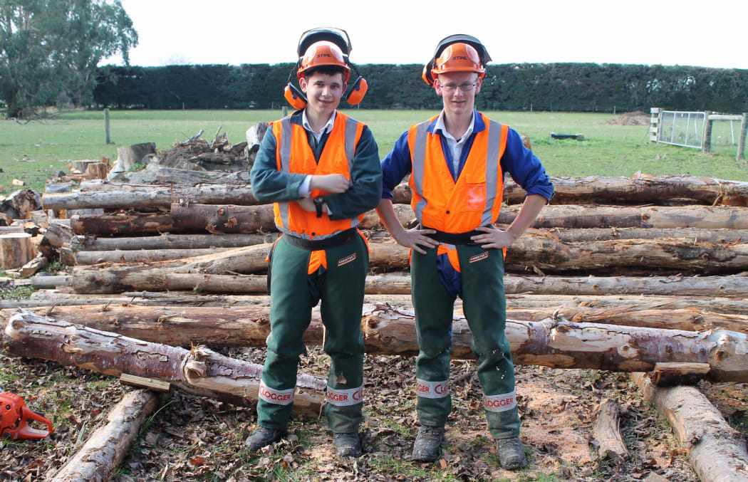 Year 12 students James Arnold and Mathew Reed learn how to use a chainsaw.