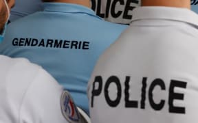 French gendarmes and police officers listen to the speech of French President at the police academy of Roubaix, northern France, on September 14, 2021. (Photo by Ludovic MARIN / various sources / AFP)