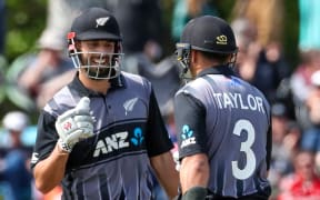 Daryl Mitchell and Ross Taylor playing for New Zealand in the T20 series against England.