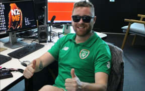 Comedian Ian McElroy enjoying the rugby result on Newstalk ZB - not the dark glasses.