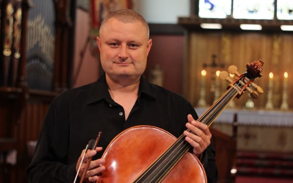 Thomas Hurnik poses with his cello