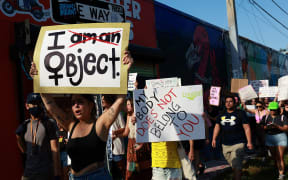 MIAMI, FLORIDA: JUNE 24: People march together to protest the Supreme Court's decision in the Dobbs v Jackson Women's Health case on June 24, 2022 in Miami, Florida. The Court's decision in the Dobbs v Jackson Women's Health case overturns the landmark 50-year-old Roe v Wade case, removing a federal right to an abortion.   Joe Raedle/Getty Images/AFP (Photo by JOE RAEDLE / GETTY IMAGES NORTH AMERICA / Getty Images via AFP)