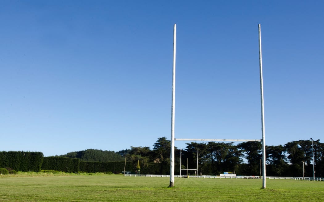 Goal posts for football, rugby union or league on field. Concept photo of sport, achievement mission and goals.