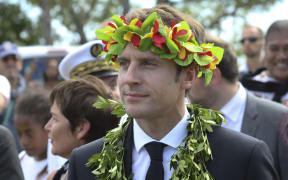 French President Emmanuel Macron takes part in a ceremony on the New Caledonia island of Ouvea. His visit to the island, the scene of a 1988 hostage crisis, was contentious.