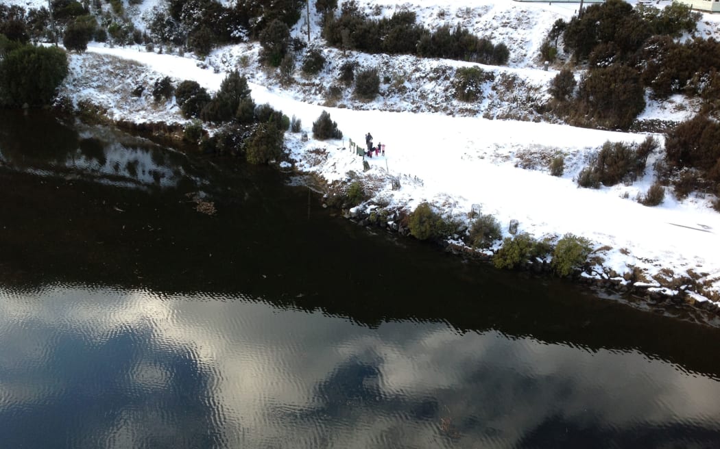 The two families were picked up by helicopter after they used an emergency phone in the area.