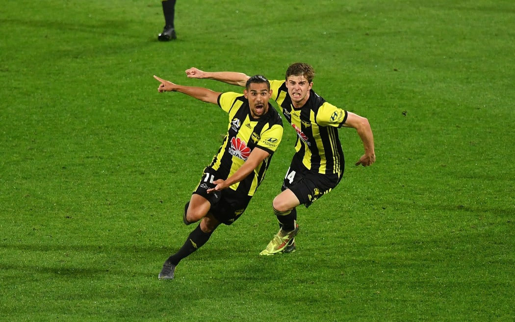 David Williams of the Phoenix celebrates his goal with team mate Alex Rufer.