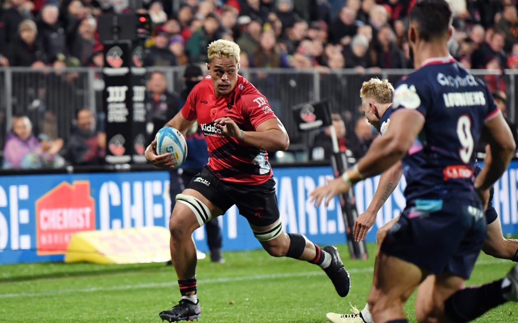 Christian Lio-Willie of the Crusaders runs through to score a try.