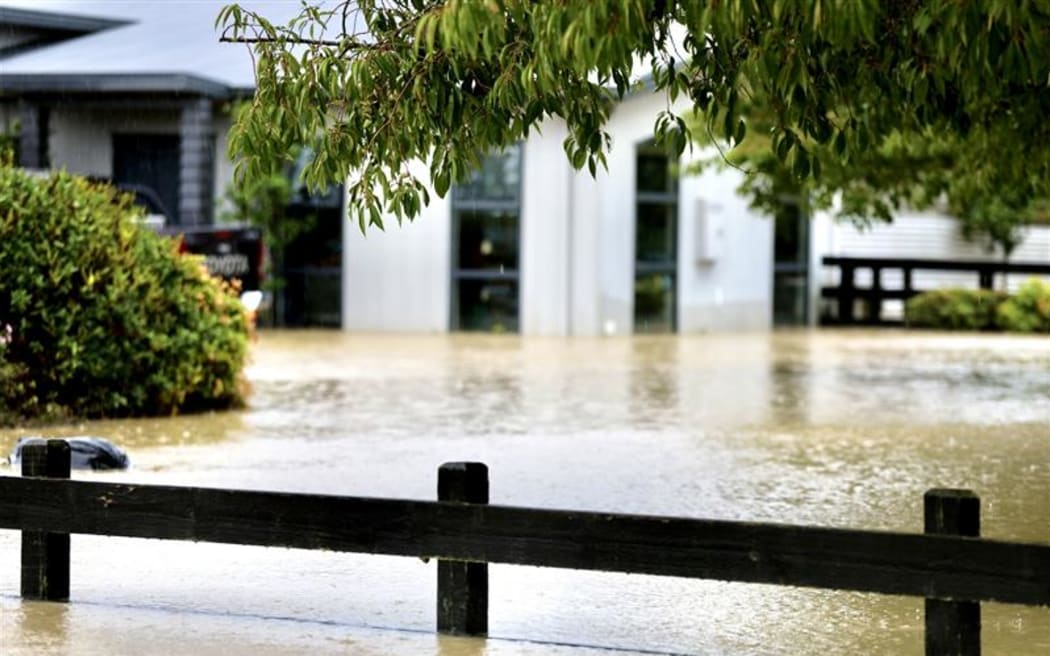 Properties in Kio Kio station road are still flooded with more rain falling on Sunday afternoon