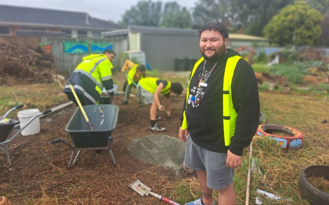 Daniel Kelly from Māngere College, next to the greenhouse site.