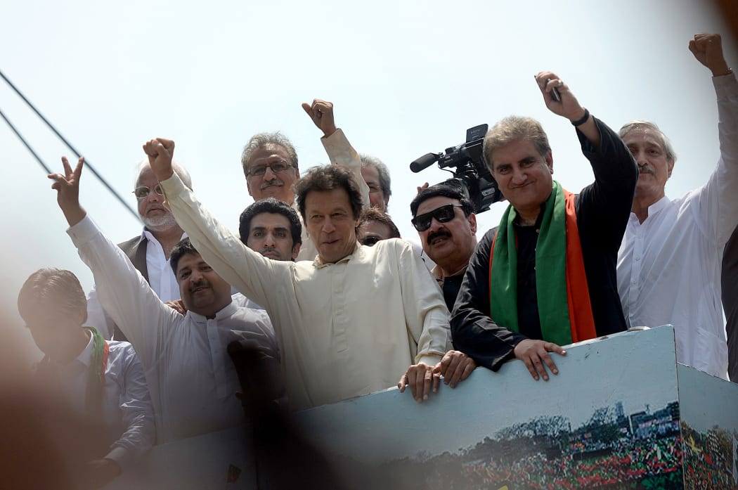 Pakistan cricketer-turned-politician Imran Khan (C) gestures as he heads a protest march from Lahore to Islamabad.