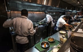 Kitchen staff in Cassia Restaurant on Fort Lane, Auckland City.