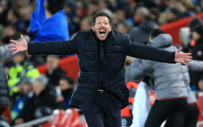 Atletico coach Diego Simeone celebrates.