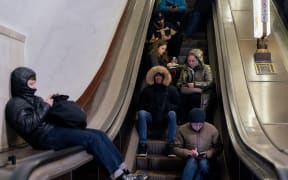 Local residents take shelter in a metro station during an air strike alarm in Kyiv, on November 28, 2024, amid the Russian invasion of Ukraine. (Photo by Tetiana DZHAFAROVA / AFP)