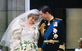 GREAT BRITAIN - JULY 29:  Prince Charles, Prince of Wales whispering to Diana, Princess of Wales on their wedding day as they appear on the balcony of Buckingham Palace  (Photo by Tim Graham/Getty Images)