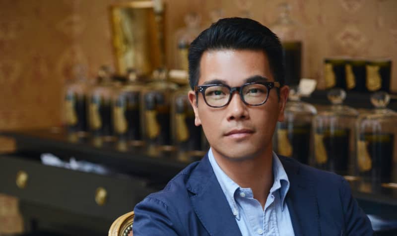 Christopher Yu sitting down and wearing glasses.