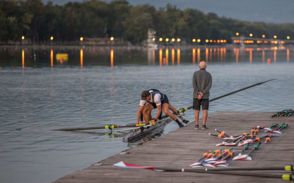 Rowing coach Noel Donaldson watches on.